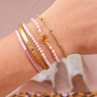 Elegantes pendientes y pulseras con los abalorios faceteados cubo