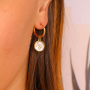 Cree joyer&iacute;a personalizada con colgantes de acero inoxidable y concha