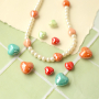 Tiempo de inspiraci&oacute;n con abalorios de cer&aacute;mica en forma de coraz&oacute;n